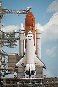brown and white space rocket near white clouds thumbnail