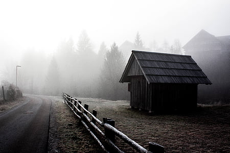 brown wooden shed near road with fence thumbnail