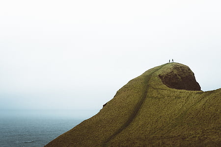 mountain in front of body of water thumbnail