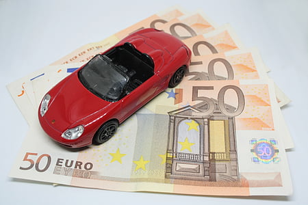 red die-cast car on 50 euro banknotes thumbnail