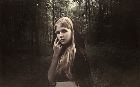 red riding hood near trees thumbnail