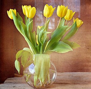 yellow tulip flowers in clear glass vase centerpiece thumbnail
