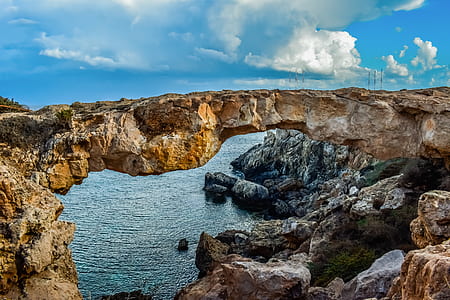 brown rock bridge during daytime thumbnail