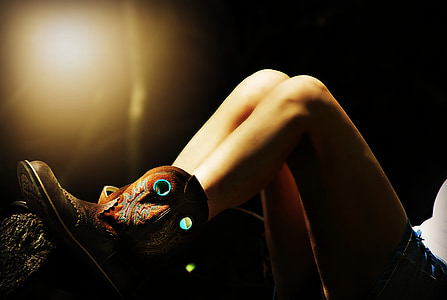 woman wearing brown cowboy boots thumbnail