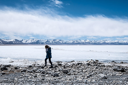 woman walking on seashore thumbnail