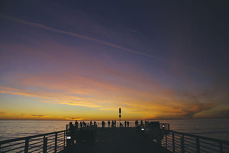 sunset photography of body of water thumbnail