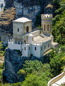 aerial photo of concrete house on stone hill at daytime thumbnail
