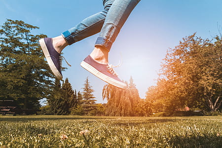 person jumping during daytime thumbnail