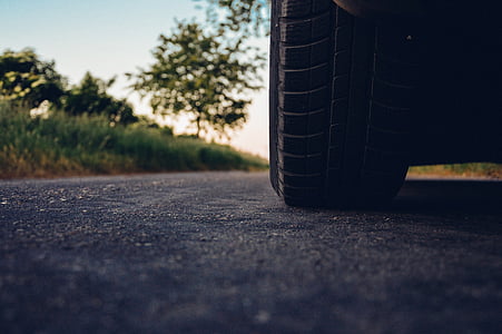 low-angle photography of vehicle tire on the middle of the road thumbnail