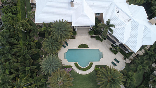birdseye photography of swimming pool and hiuse thumbnail