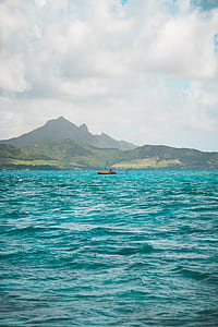 wooden boat on body of water thumbnail