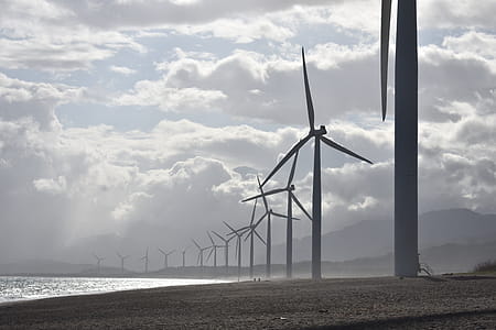 Windmills on Seashore Under White Clouds thumbnail