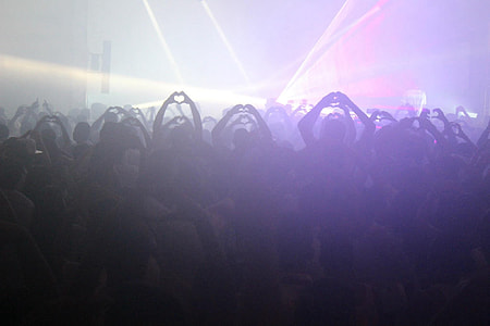 group of people inside the club with strobe lights thumbnail