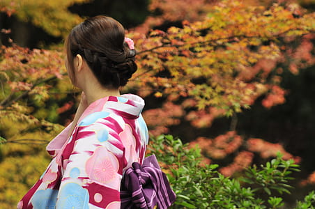 woman wearing kimono looking at trees thumbnail