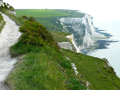 cliff and body of water at daytime thumbnail