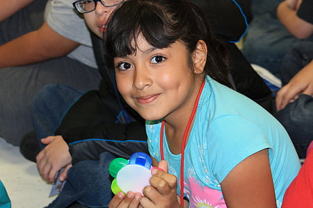 girl wearing blue crew-neck shirt thumbnail