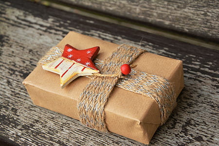 brown and red gift box on brown wooden surface thumbnail