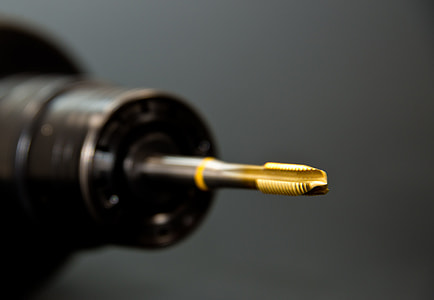 selective photography of gold threaded rod thumbnail