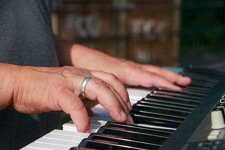 person playing black electronic keyboard thumbnail