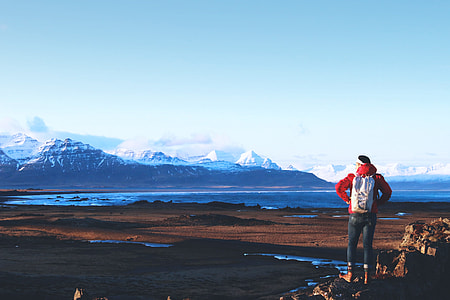 A hiker views the stunning mountains and vistas in Iceland thumbnail