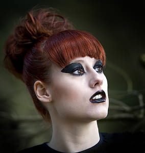 woman wearing black shirt with black makeup thumbnail