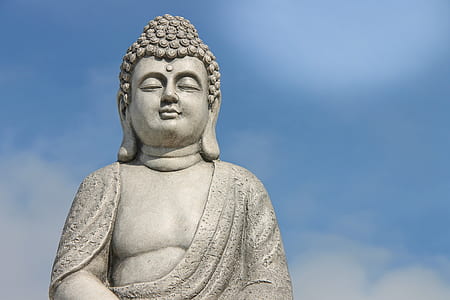 gray Buddha statue under blue sky at daytime thumbnail