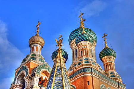 green and blue concrete church during daytime thumbnail
