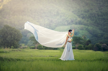 woman wearing white crop top and white maxi skirt thumbnail