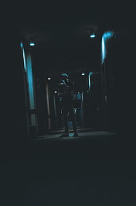 man standing between lockers thumbnail