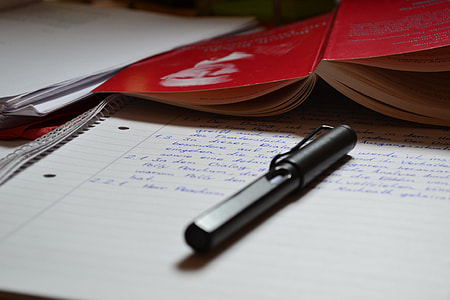 black pen on white ruled paper thumbnail