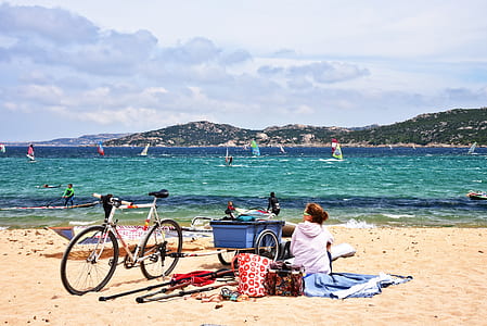 woman having a picnic on beach at daytime thumbnail