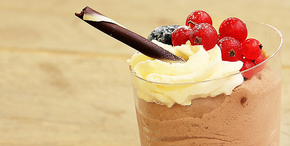 glass of chocolate shake with cherries and wafer stick thumbnail