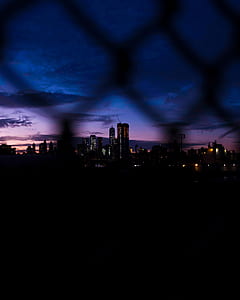 silhouette of buildings during night thumbnail