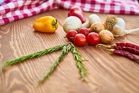 assorted spices on beige wooden table thumbnail