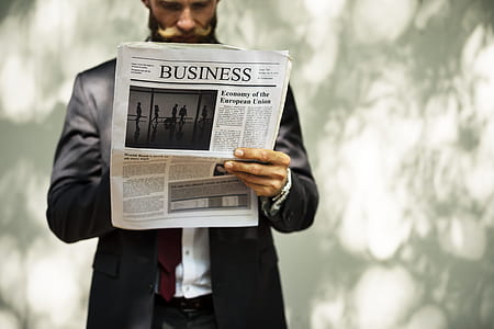 man reading newspaper thumbnail