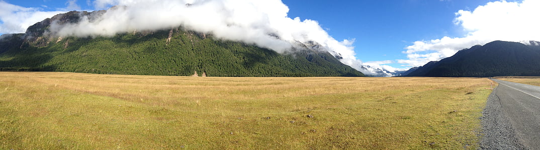 landscape photography of grass field during daytime thumbnail