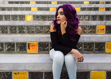 woman sitting on gray stair at daytime thumbnail
