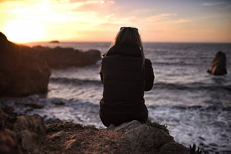 woman sitting on rock thumbnail