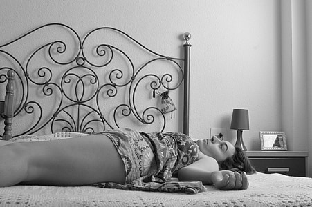 woman lying on bed thumbnail