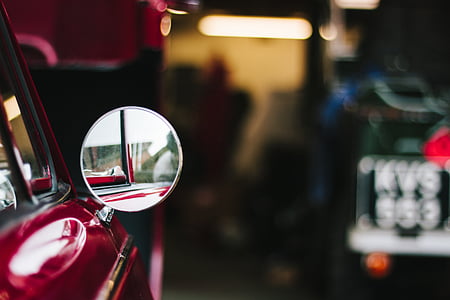selective focus photo of red car thumbnail