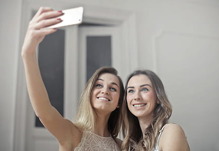 Two Young Women taking a selfie together at home thumbnail