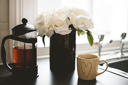 white petaled flower with vase on table thumbnail