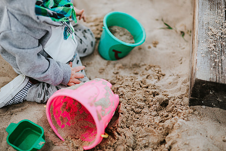Toddler playing in the sand thumbnail