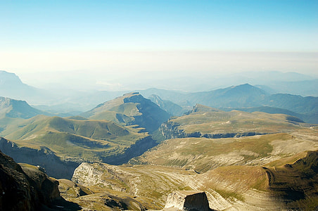 green and gray mountains  beside each other during day time thumbnail
