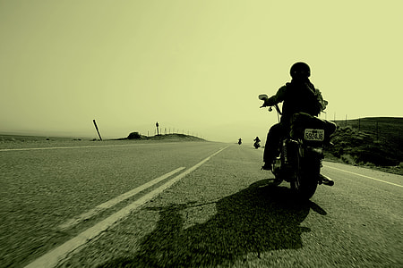 worm's-eye view of person riding on motorcycle thumbnail