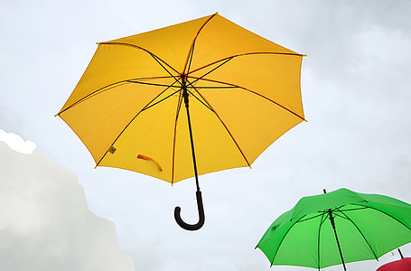 floating umbrellas during cloudy day thumbnail
