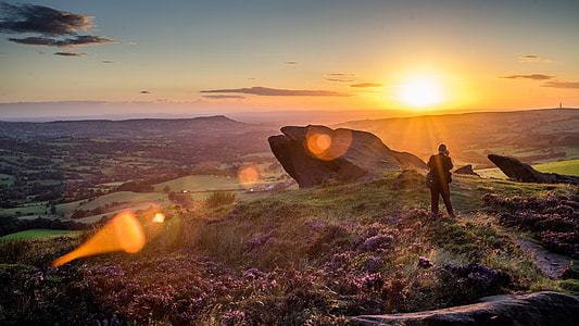 person standing near mountain top on sunset thumbnail