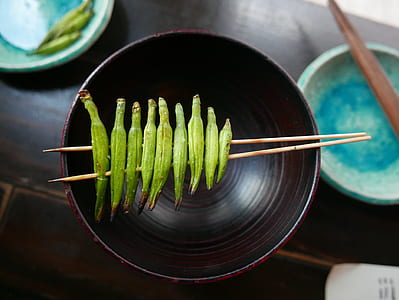 green vegetables impaled by sticks thumbnail