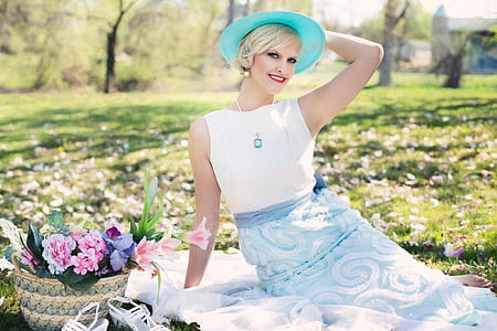 woman wearing blue hat and white dress thumbnail