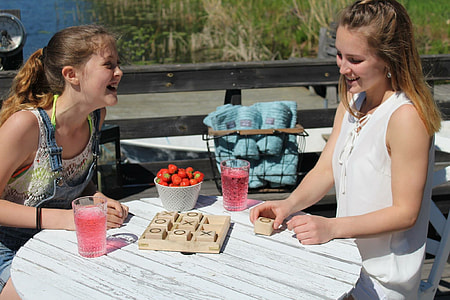 two women playing tic-tac-toe game thumbnail